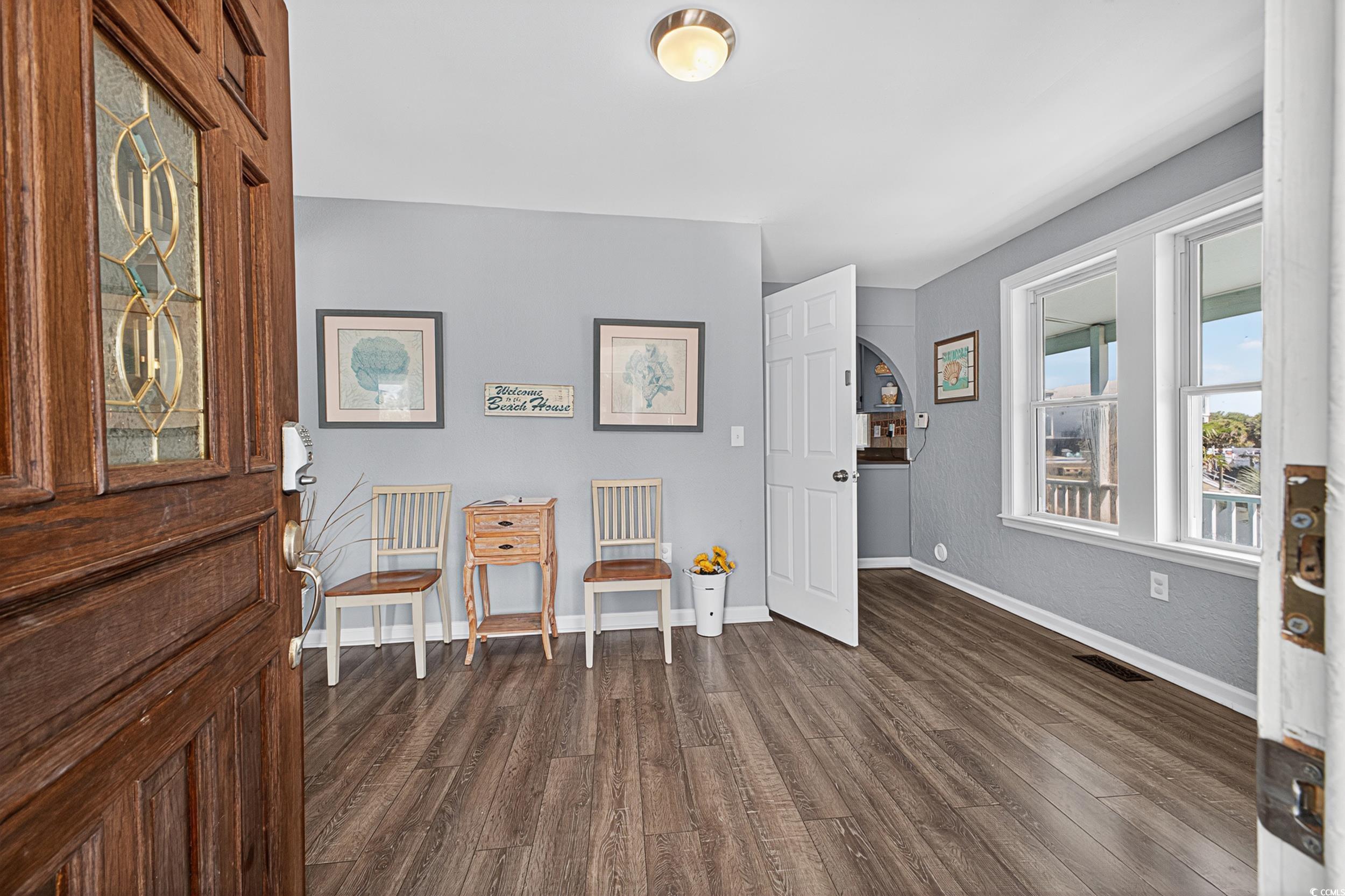 1885 Pompano Drive Murrells Inlet, SC 29576 - Photo 25 of 34 Foyer entrance with dark wood finished floors and baseboards