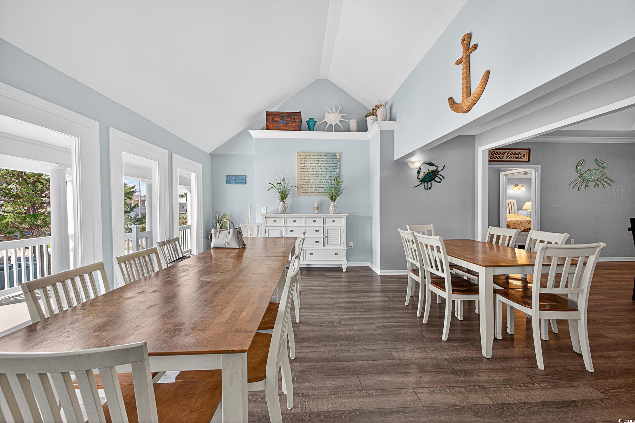 1885 Pompano Drive Murrells Inlet, SC 29576 - Photo 26 of 34 Dining area with dark wood-style flooring and high vaulted ceiling