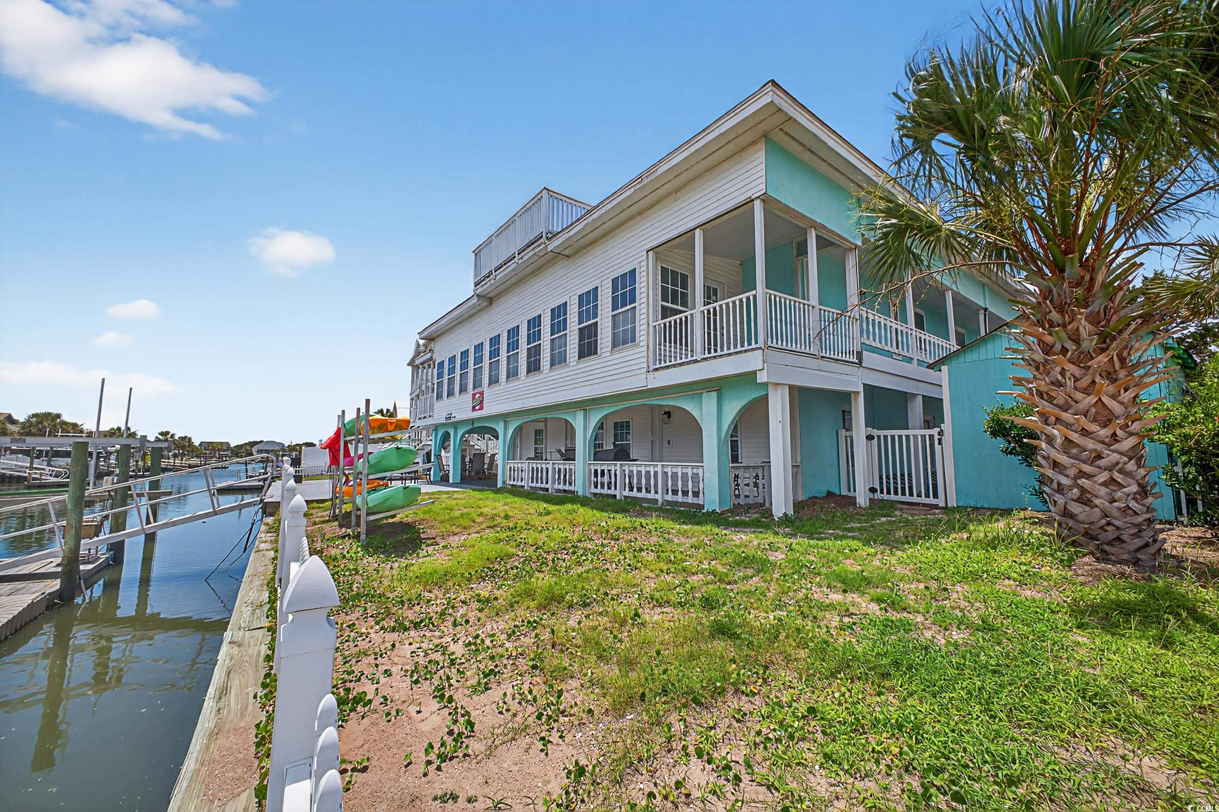 1885 Pompano Drive Murrells Inlet, SC 29576 - Photo 33 of 34 Back of house featuring a balcony and a water view