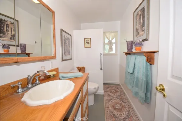 a bathroom with a sink and mirror