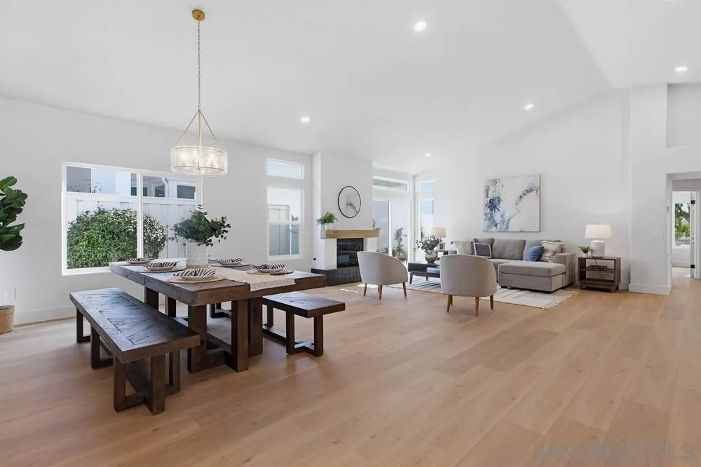 4959 Lamia Way Oceanside, CA 92056 - Photo 14 of 63 a living room with furniture a table and a chandelier