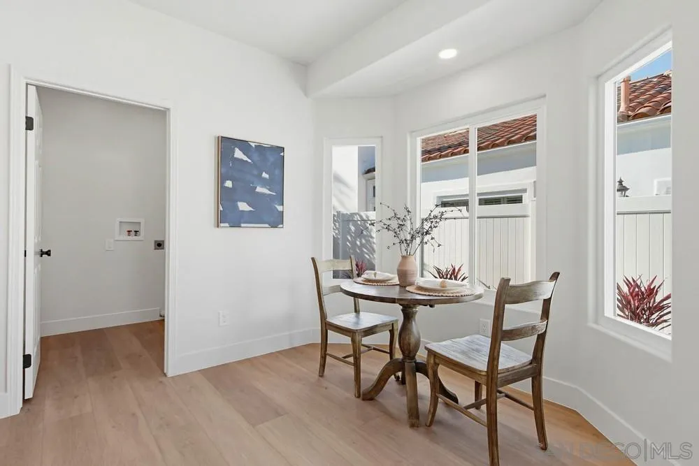 4959 Lamia Way Oceanside, CA 92056 - Photo 20 of 63 a view of a dining room with furniture and wooden floor