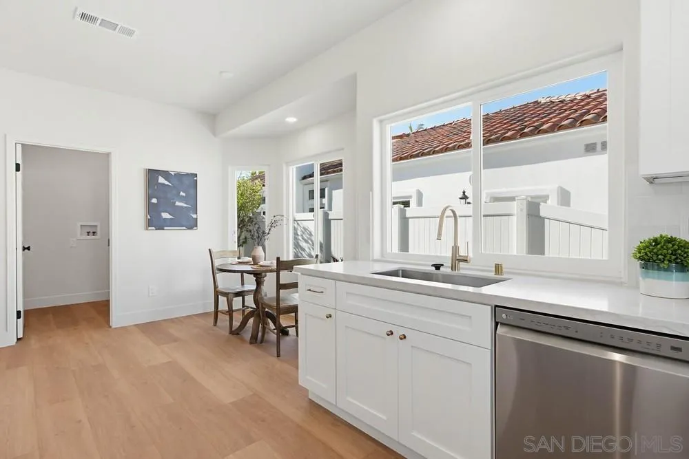 4959 Lamia Way Oceanside, CA 92056 - Photo 24 of 63 a kitchen with a sink cabinets and window