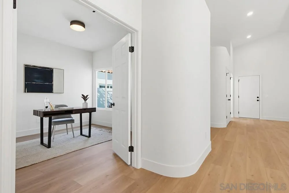 4959 Lamia Way Oceanside, CA 92056 - Photo 27 of 63 a view of a workspace with furniture and a flat screen tv