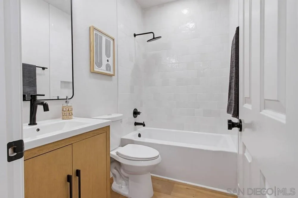 4959 Lamia Way Oceanside, CA 92056 - Photo 32 of 63 a bathroom with a sink a toilet and shower