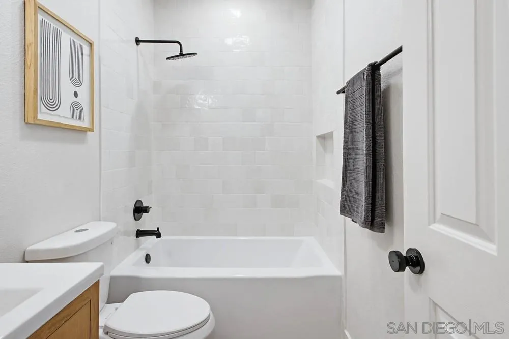 4959 Lamia Way Oceanside, CA 92056 - Photo 33 of 63 a bathroom with a shower a toilet and a tub