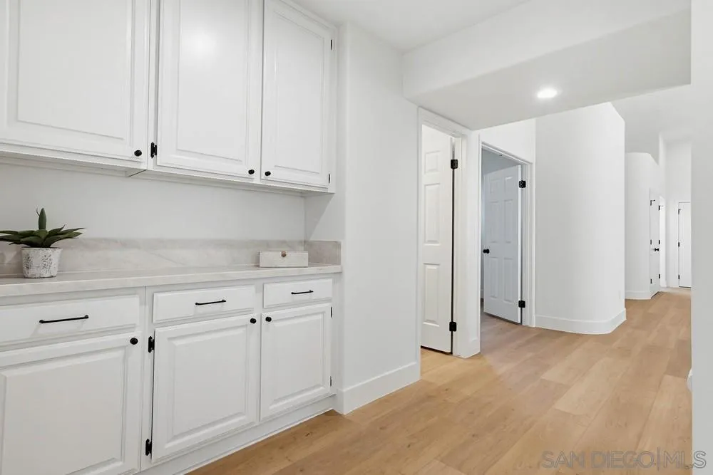 4959 Lamia Way Oceanside, CA 92056 - Photo 35 of 63 a view of cabinets and wooden floor