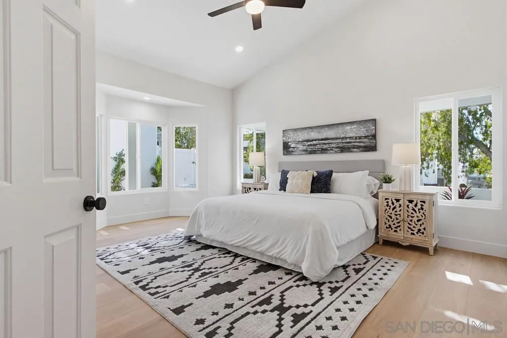 4959 Lamia Way Oceanside, CA 92056 - Photo 36 of 63 a bedroom with a large bed and a window