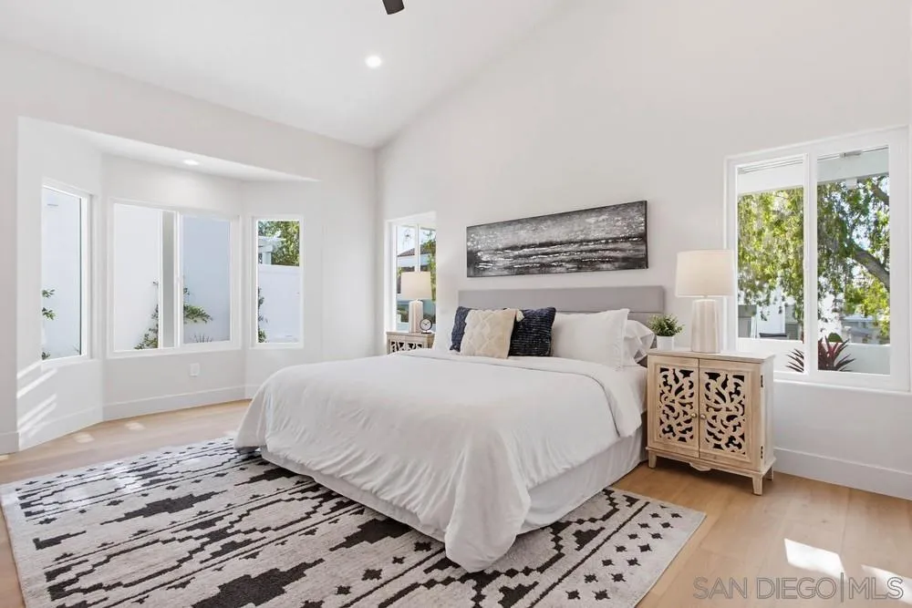 4959 Lamia Way Oceanside, CA 92056 - Photo 37 of 63 a bedroom with a large bed and a window