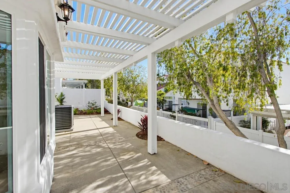 4959 Lamia Way Oceanside, CA 92056 - Photo 54 of 63 a view of a porch with furniture and a backyard