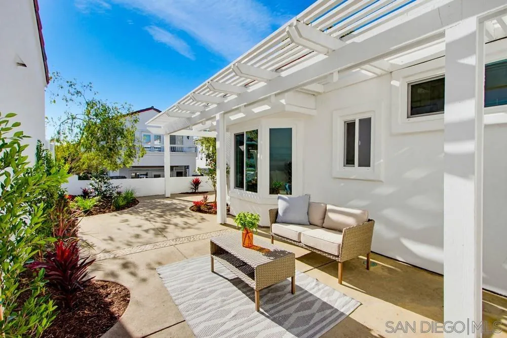 4959 Lamia Way Oceanside, CA 92056 - Photo 61 of 63 a outdoor space with patio the couches and a potted plant on the table