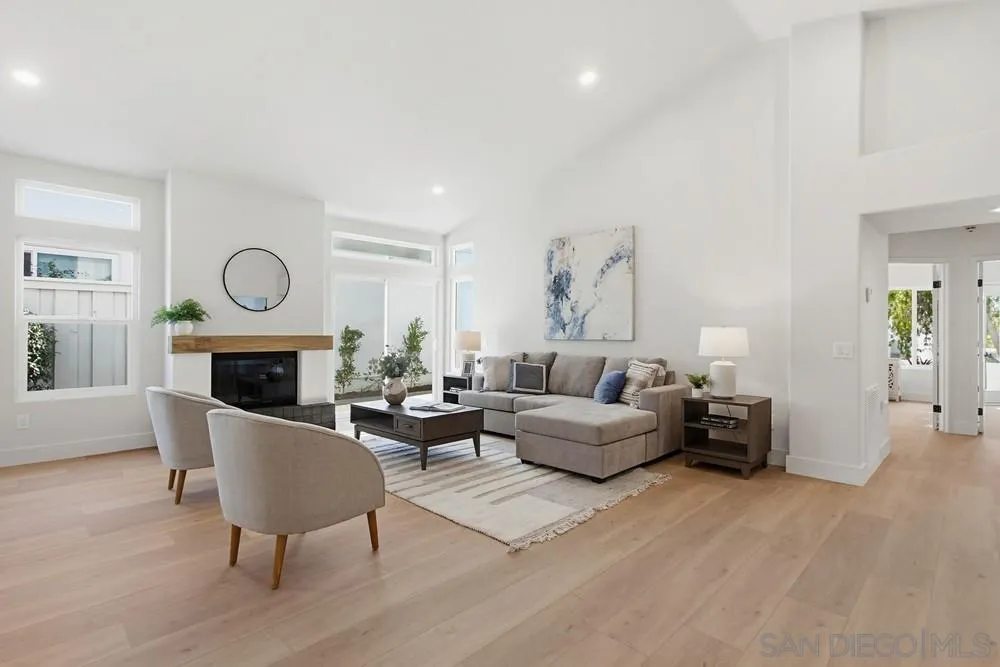 4959 Lamia Way Oceanside, CA 92056 - Photo 9 of 63 a living room with furniture a fireplace and a table