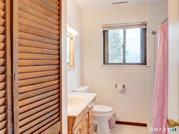 a bathroom with a toilet and a sink