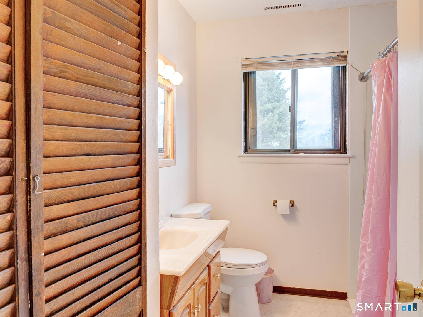 285 Queen Street, Unit 1C Southington, CT 06489 - Photo 17 of 33 a bathroom with a toilet and a sink