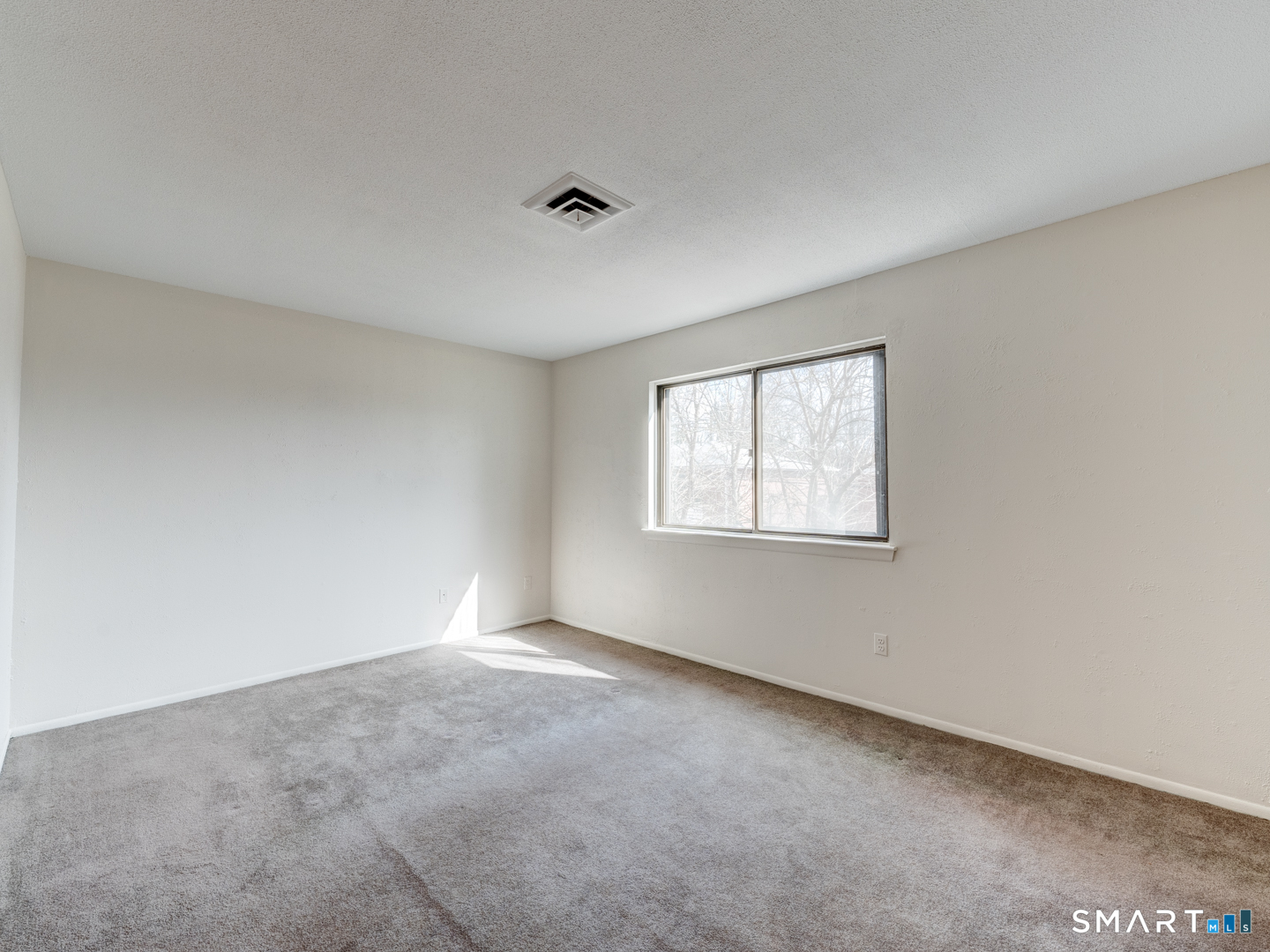 285 Queen Street, Unit 1C Southington, CT 06489 - Photo 18 of 33 an empty room with windows