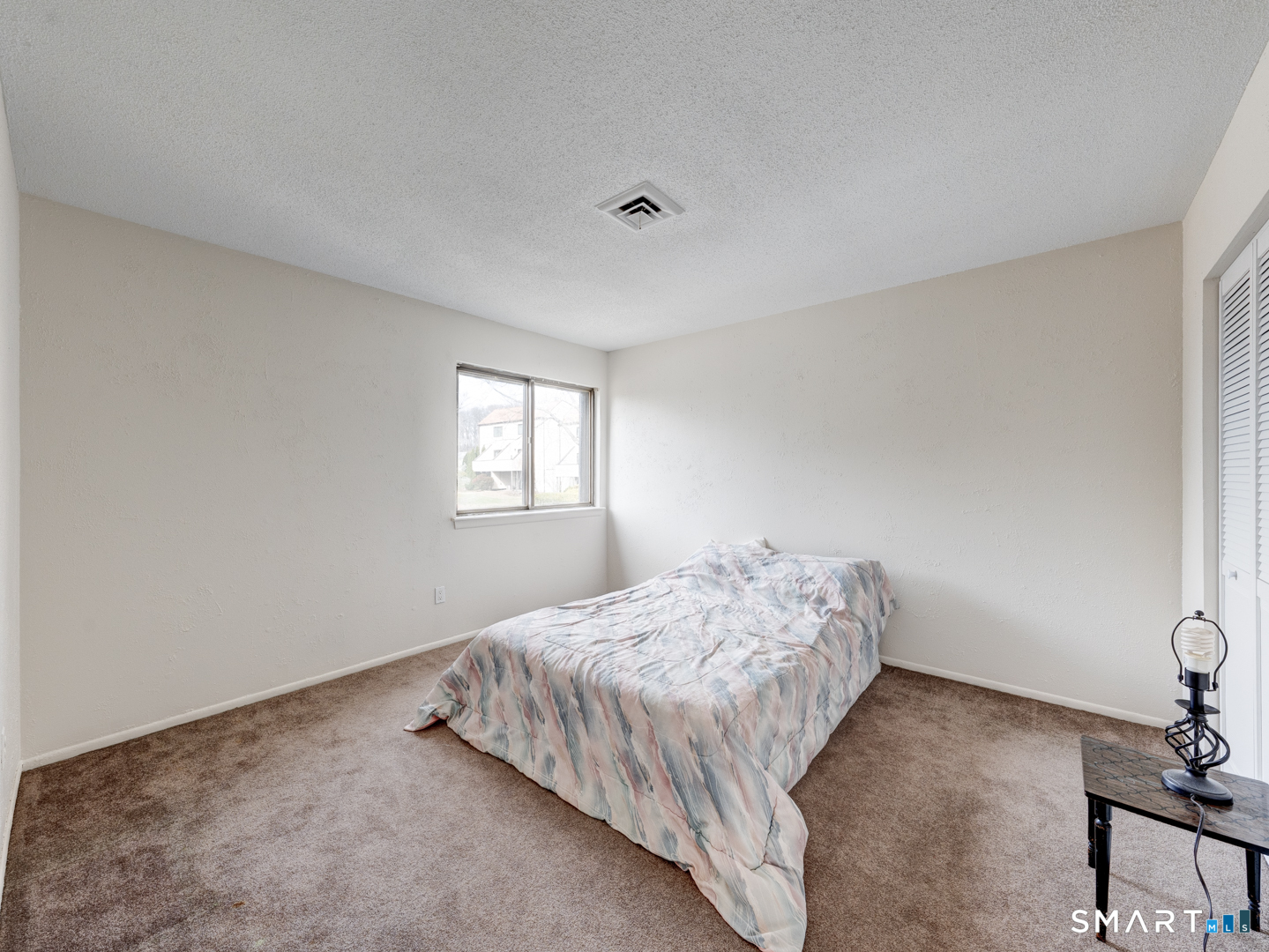 285 Queen Street, Unit 1C Southington, CT 06489 - Photo 20 of 33 a bedroom with a bed and window