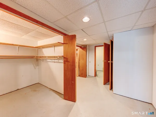 a view of an empty room and a window