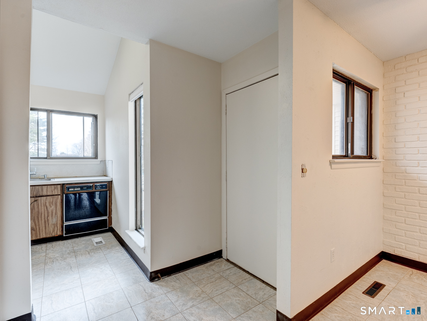 285 Queen Street, Unit 1C Southington, CT 06489 - Photo 3 of 33 a view of an empty room with a window and fire place