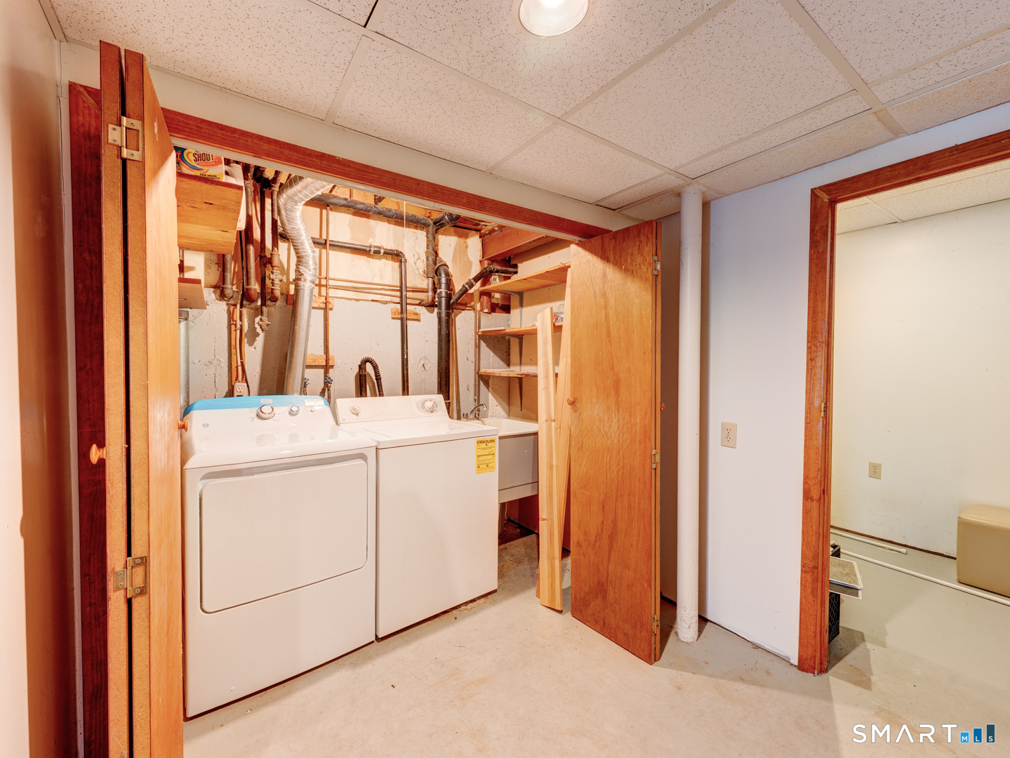 285 Queen Street, Unit 1C Southington, CT 06489 - Photo 32 of 33 a room with a large window and dryer