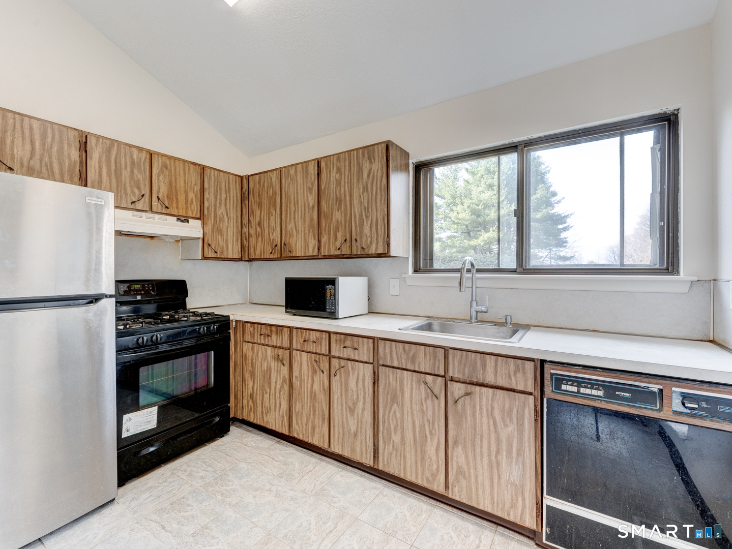 285 Queen Street, Unit 1C Southington, CT 06489 - Photo 4 of 33 a kitchen with a sink appliances and cabinets