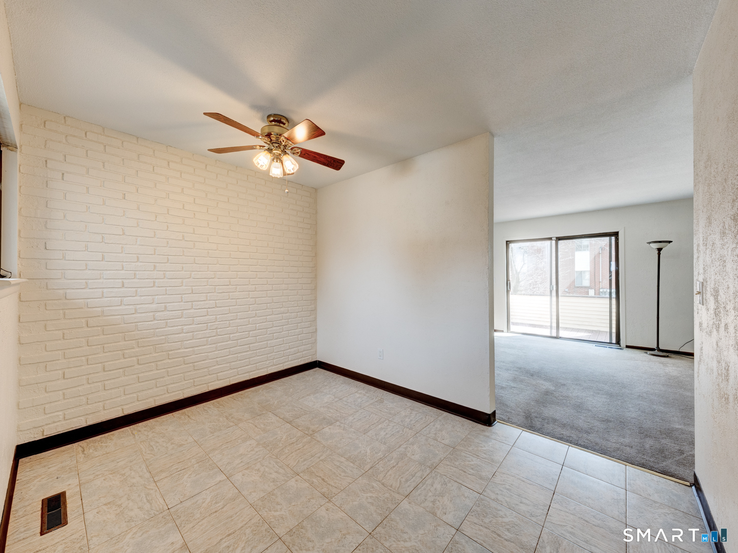 285 Queen Street, Unit 1C Southington, CT 06489 - Photo 8 of 33 a view of empty room with a ceiling fan and a window