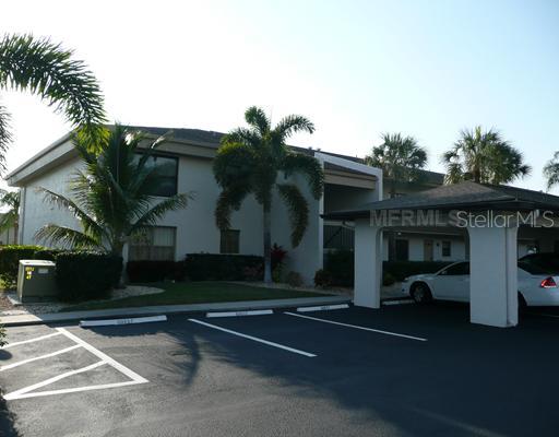 227 Coldeway Drive, Unit B1 Punta Gorda, FL 33950 - Photo 1 of 1 Exterior Front - Bridge Point condominium... 2 bedroom, 2 bath water front end unit with covered parking/