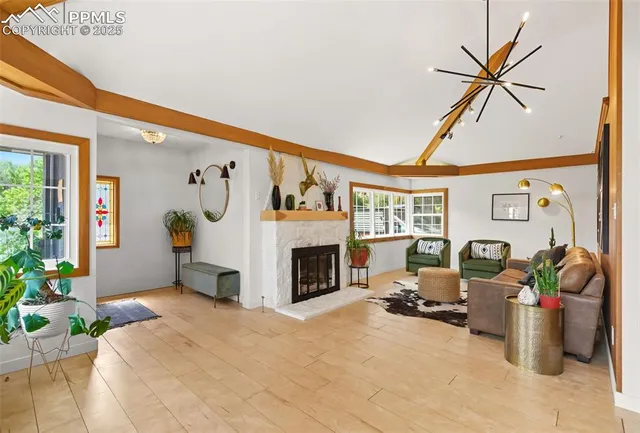 a living room with furniture and a fireplace