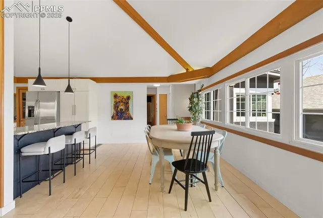 a kitchen with granite countertop a stove and a wooden floor