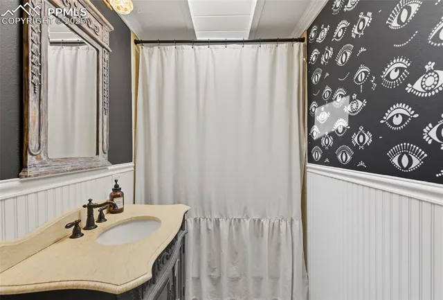 a bedroom with a bed dresser and a window