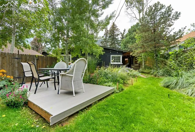 a outdoor living space with furniture and garden view
