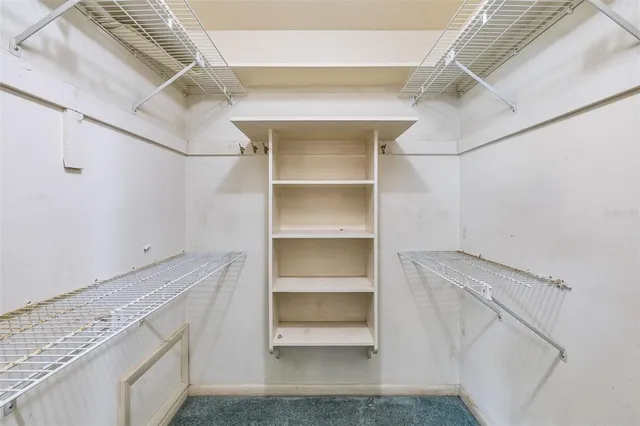 a view of an empty walk in closet