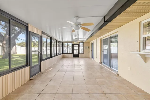 a view of a porch with wooden floor and iron stairs