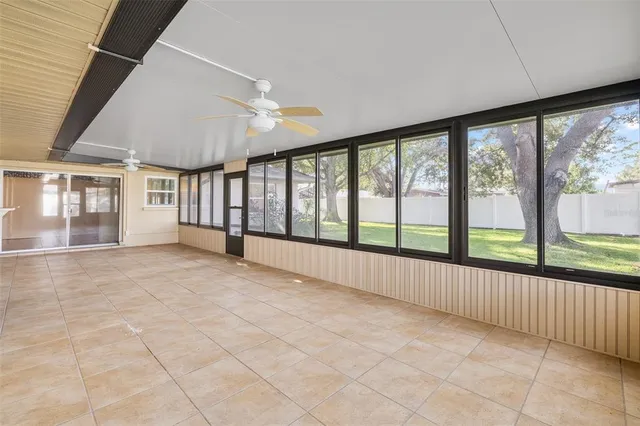 a view of an empty room with a large window