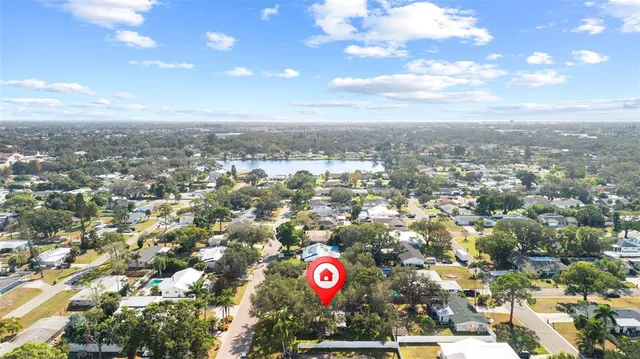 an aerial view of city and mountain