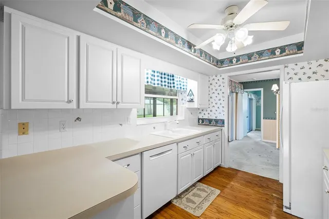 a bathroom with a sink a large mirror and a bathtub