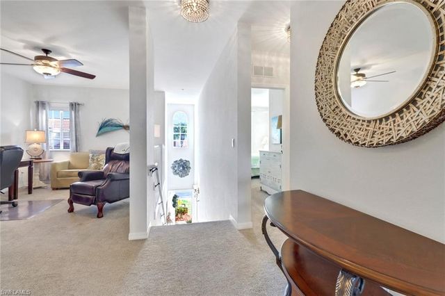 a view of a livingroom with furniture and a chandelier