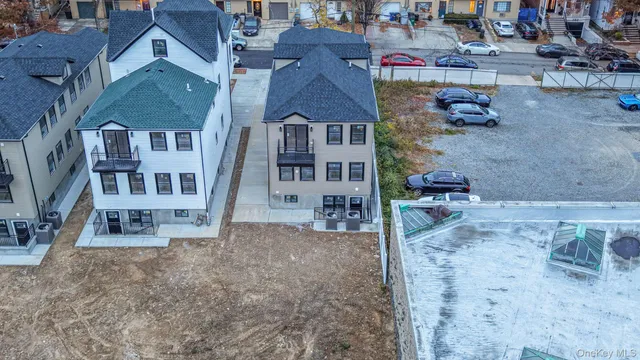 an aerial view of a house with a swimming pool
