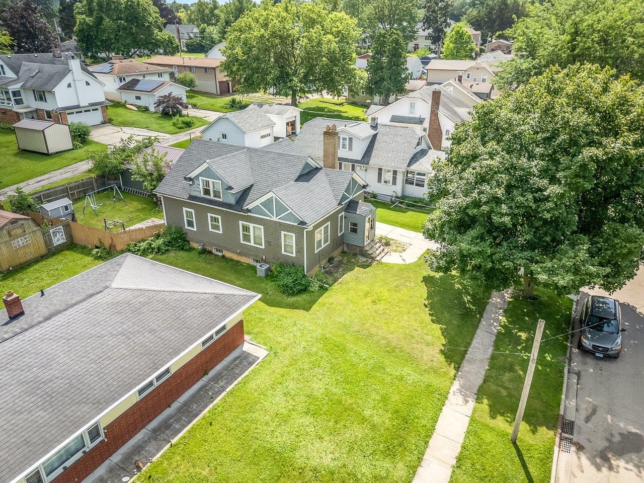 1247 West Logan Street Freeport, IL 61032 - Photo 28 of 34 an aerial view of a house with swimming pool and large trees