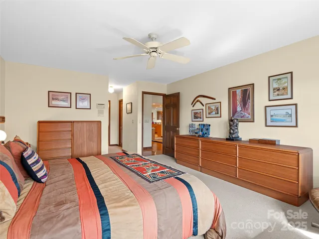 a bathroom with a tub a sink and mirror