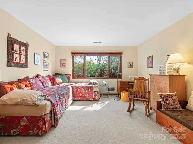 a living room with furniture fireplace and flat screen tv