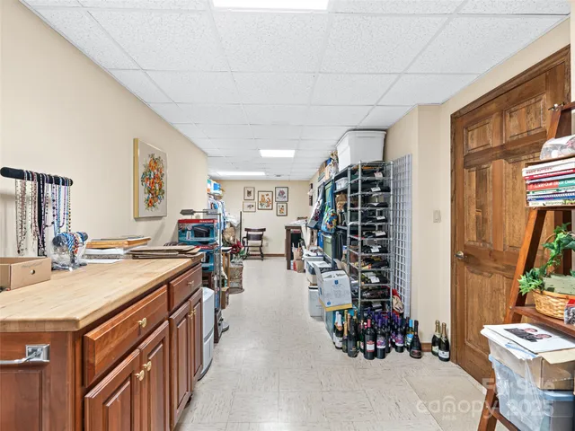 a balcony with wooden floor table and chairs