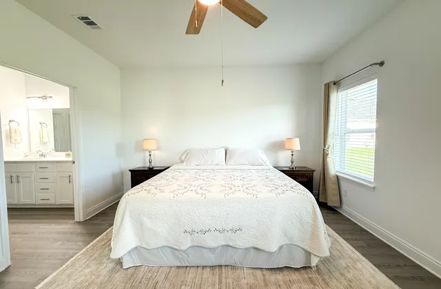 a bedroom with a bed and window