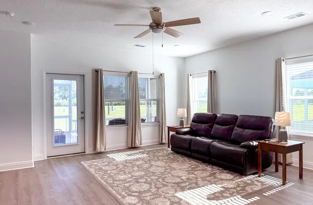 a living room with furniture and a rug