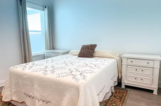 a bedroom with a bed and a dresser