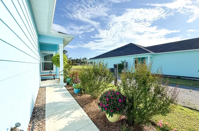 a view of a house with a garden