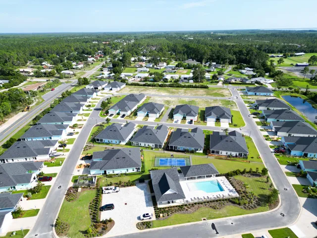 a view of multiple houses with outdoor space