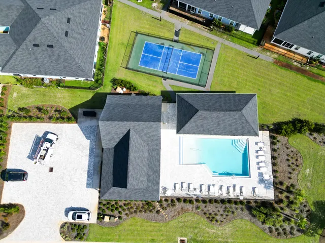 a view of swimming pool with outdoor seating