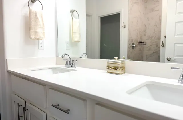 a bathroom with a sink and a large mirror