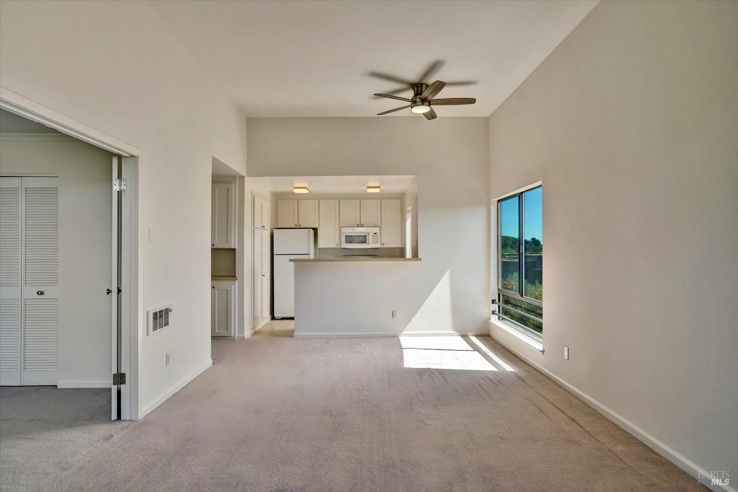 600 Seaver Drive Mill Valley, CA 94941 - Photo 11 of 30 a view of a big room with windows and chandelier fan