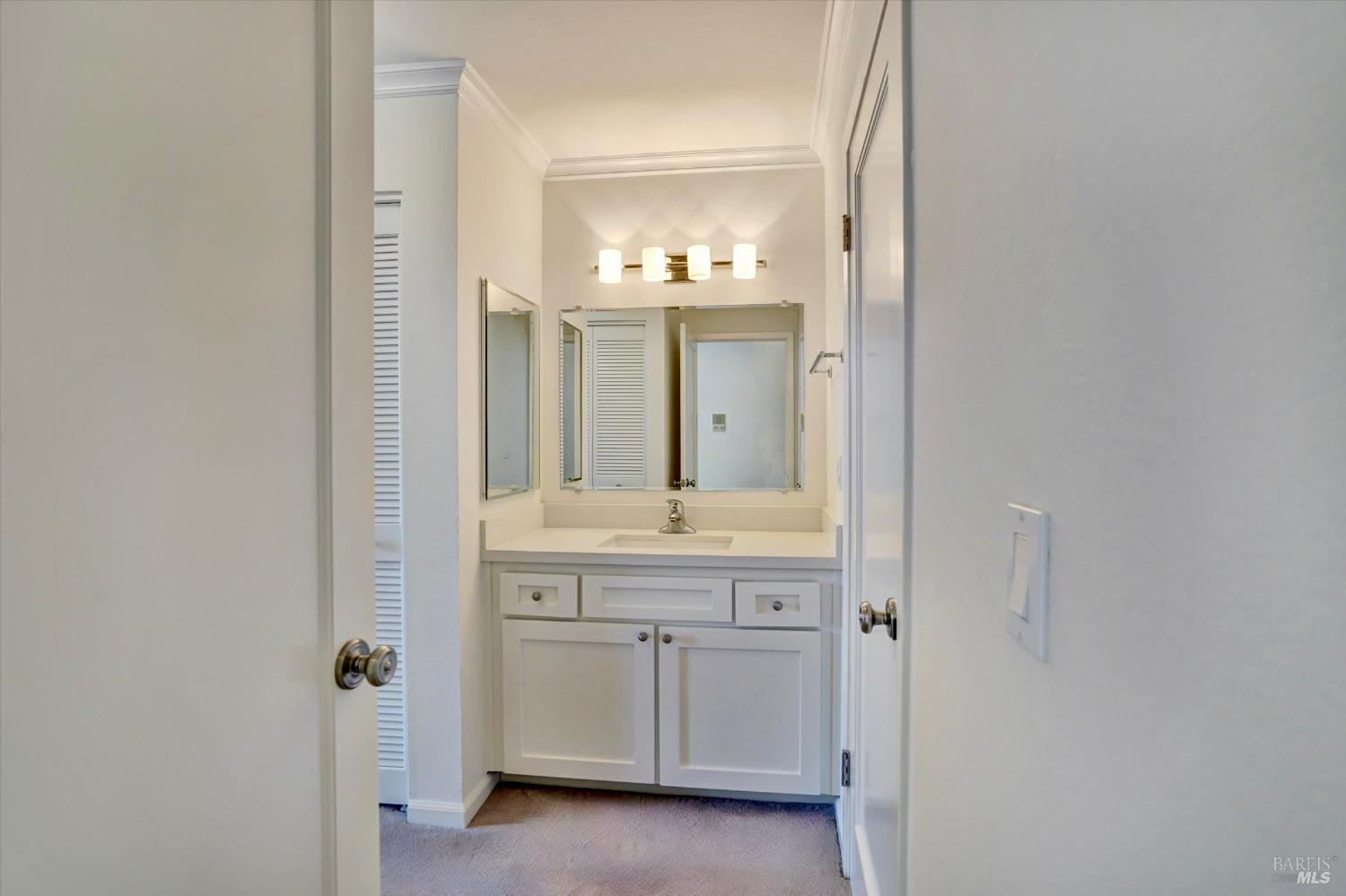 600 Seaver Drive Mill Valley, CA 94941 - Photo 27 of 30 a bathroom with a granite countertop sink a mirror and a